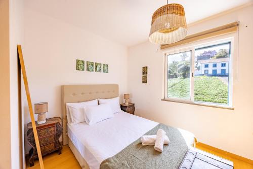 Postel nebo postele na pokoji v ubytování Zezita's Place