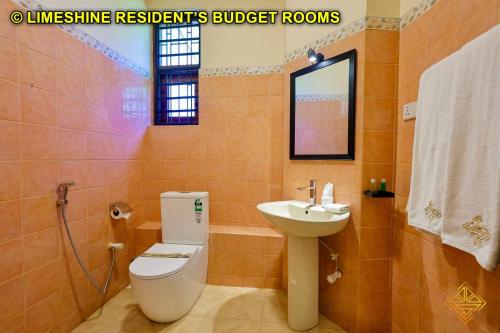 a bathroom with a toilet and a sink at Limeshine - Airport Transit Hotels & Residences in Katunayake