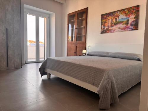 Letto o letti in una camera di Palazzo Umberto