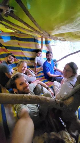 a group of people sitting in a tent at Maji Homestay Khajuraho in Khajurāho