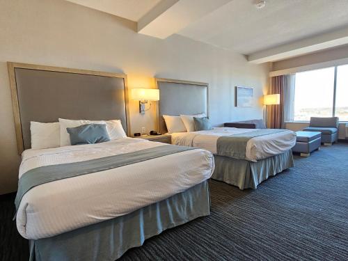 Postel nebo postele na pokoji v ubytování Vittoria Hotel & Suites