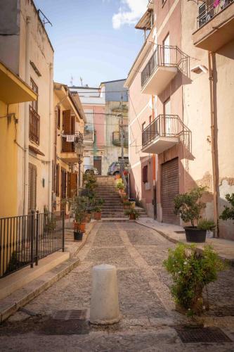 an empty alley with stairs in an old building at Sunshine Apartments in Trappeto