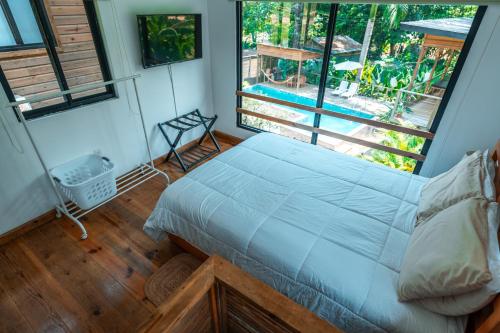 Postel nebo postele na pokoji v ubytování MALU Cabins