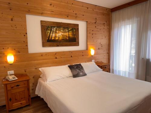 Postel nebo postele na pokoji v ubytování Albergo Scoiattolo