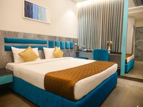 Ένα ή περισσότερα κρεβάτια σε δωμάτιο στο Hotel Grand Sudhan