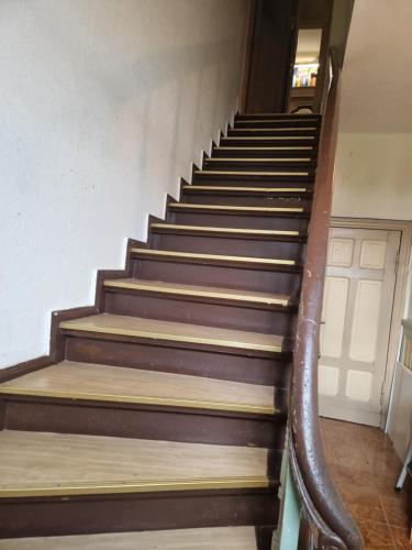 a set of stairs in an old building at 2-Etagen-Wohnung im Haus am See von Berlin in Zeuthen
