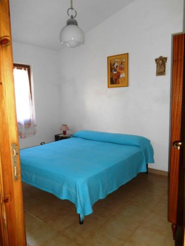 Ένα ή περισσότερα κρεβάτια σε δωμάτιο στο Casa delle Ginestre