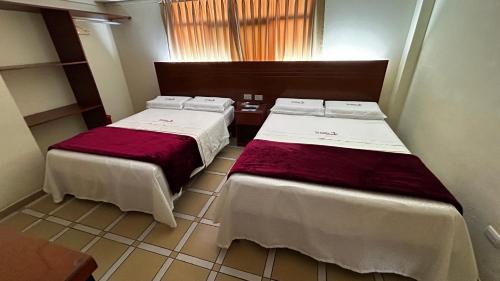 Postel nebo postele na pokoji v ubytování Hotel Los Arcos de Imperial