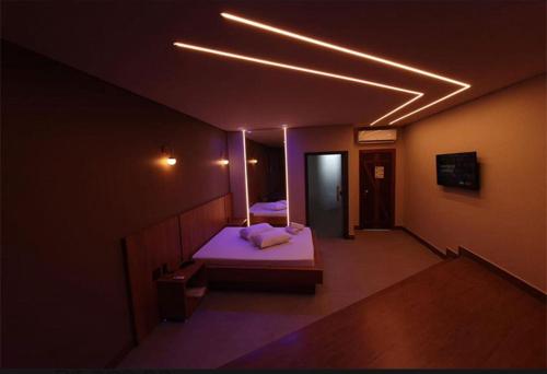 Katil atau katil-katil dalam bilik di Jardins Suites