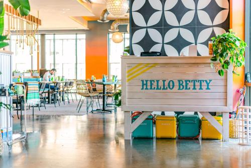 a hello berky sign on a bench in a restaurant at Canopy By Hilton Washington DC Bethesda North in North Bethesda