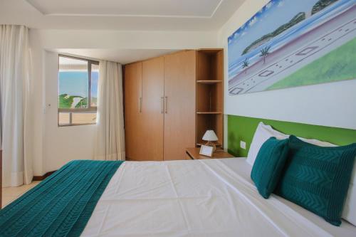 Mirador Praia Suítesにあるベッド