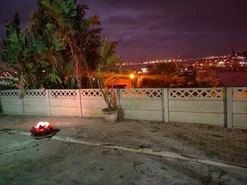 a fire hydrant on the side of a house at night at MayBach Hills Palace Guesthouse in Saldanha