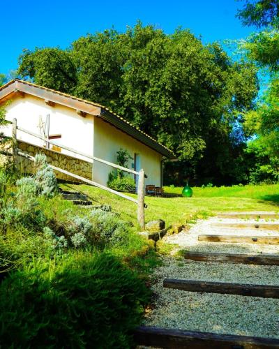 a small white building in the middle of a field at Borgo Pallavicini Mori in Prima Porta