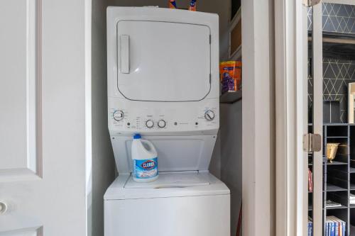 a bottle of milk sitting on top of a washer at Hackberry Hideaway - Osage Beach in Montreal