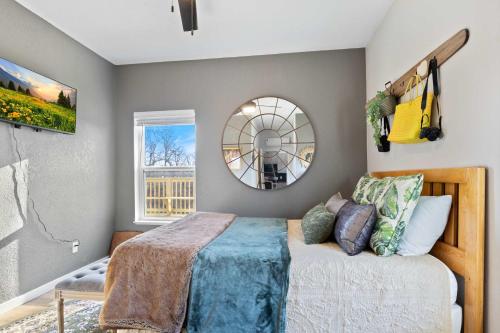 a bedroom with a bed and a mirror at Hackberry Hideaway - Osage Beach in Montreal