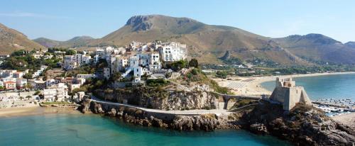 an aerial view of a town on a beach at Hotel Amyclae in Sperlonga