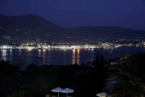 a view of a large body of water at night at Akrotiri Hotel in Parikia