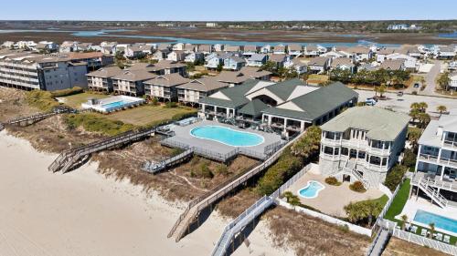 an aerial view of a house on the beach at Oceanview 4BR/4BA Condo, Steps to Beach/Pool in Ocean Isle Beach