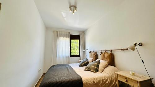 Ένα ή περισσότερα κρεβάτια σε δωμάτιο στο Apartamento al mar