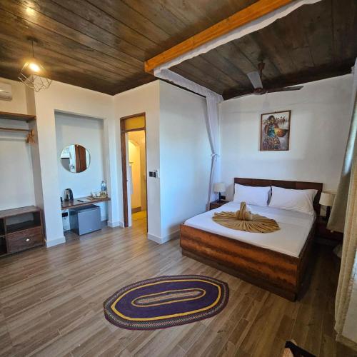 Postel nebo postele na pokoji v ubytování Mambo Ocean Resort