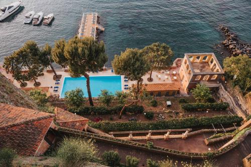 an aerial view of a house next to the water at Grand Hotel Europa Palace Sorrento in Sorrento