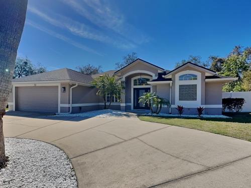 a house with a driveway in front of it at Shore Thing in Palm Coast