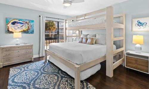 a bedroom with a bunk bed and a window at Silver Sands Townhomes Unit 4 in Inlet Beach