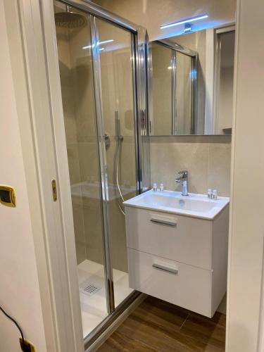 a bathroom with a sink and a shower at La casa di nonna chella in Bari