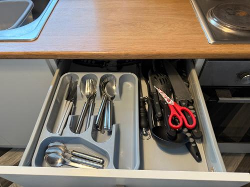a drawer filled with utensils in a cabinet at Bexley-4 Bdrm 5 beds Sleeps 7 Ideal 4 Contractors in Pallion