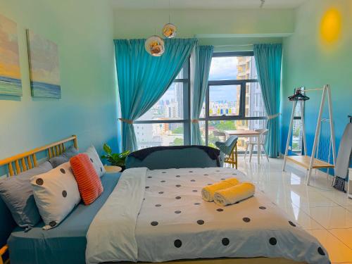 a bedroom with a large bed and a large window at 3 Towers Jalan Ampang By Serenity Vacation Homes in Kuala Lumpur