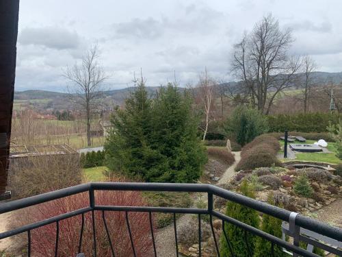 a view of a garden from the balcony of a house at Chalupa Adamův Dvůr in Zdíkov