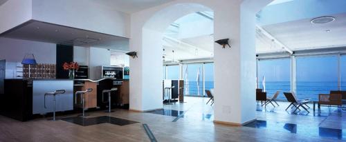 a large room with a view of the ocean at Hotel Amyclae in Sperlonga