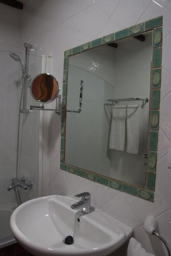 a bathroom with a sink and a mirror at HOTEL FONDA de La TEA in Tejeda
