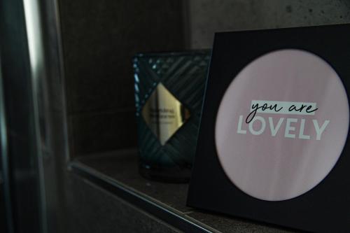 a mirror sitting on a shelf with a sign that says you are loyalty at Ferienhaus AlbSommer - FehlaTal in Burladingen