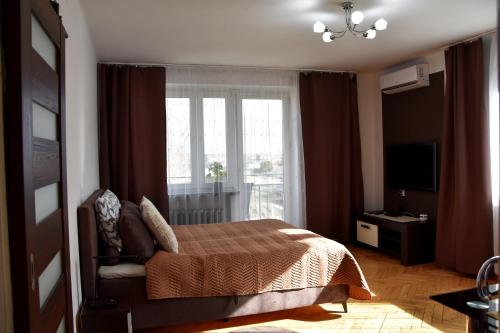 Posteľ alebo postele v izbe v ubytovaní Travel Apartament Cracow
