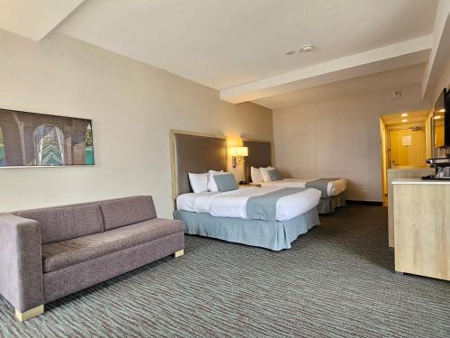Postel nebo postele na pokoji v ubytování Vittoria Hotel & Suites