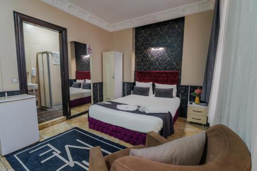 Postel nebo postele na pokoji v ubytování Nest HOTEL Sisli