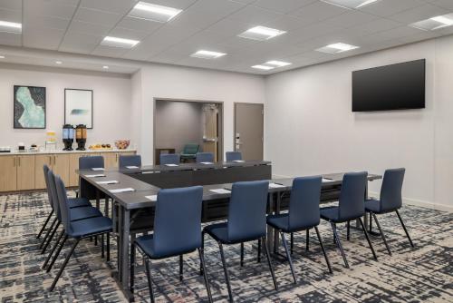 a conference room with a long table and chairs at Homewood Suites By Hilton Thornton Denver in Thornton