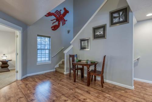 a dining room with a table and a lobster on the wall at A Lobster Lookout in Lincoln City