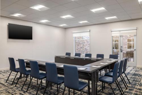 a conference room with a large table and chairs at Homewood Suites By Hilton Thornton Denver in Thornton