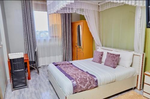 Postel nebo postele na pokoji v ubytování Bb hotel mbarara