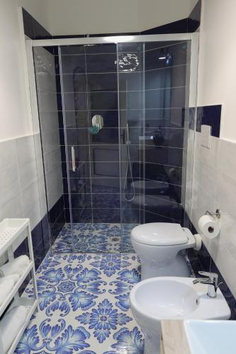 a bathroom with a shower and a toilet and a sink at La Tua Terrazza in Costiera in Albori