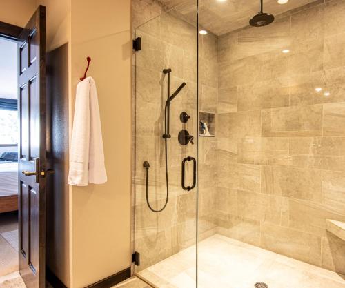 a bathroom with a shower with a glass door at Christophe Condo 712 in Ketchum