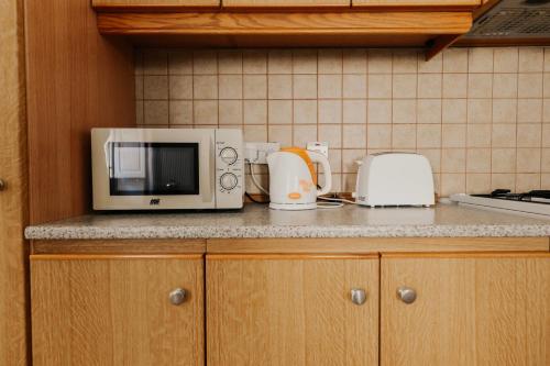 Kuchyň nebo kuchyňský kout v ubytování GELMIF Apartments