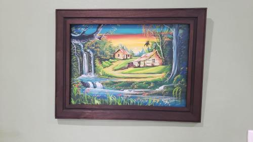 a picture of a painting of a house and a waterfall at Casa tipica in Fortuna