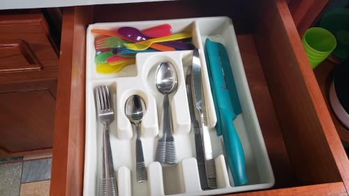 a drawer with utensils and utensils sidx sidx sidx sidx at Casa tipica in Fortuna