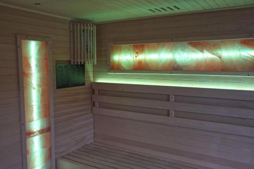 a sauna with wooden walls and aitatingificialificialificialificialificialificialificial at Ferienapartment Zur guten Quelle in Bad Liebenstein