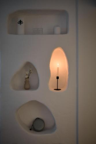 a bathroom with a sink with a candle in it at Ikigai Tivat Parisian Apartment in Tivat