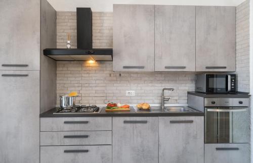 Dapur atau dapur kecil di Sardinia Family Villas - Cannigione Beach Apartments