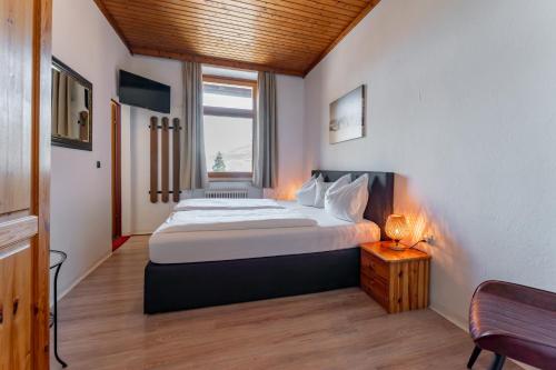 Postel nebo postele na pokoji v ubytování Hotel Gasthof Post
